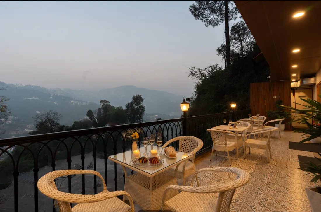 Evaara Woods mountain-facing terrace, set for a quiet evening overlooking Shimla